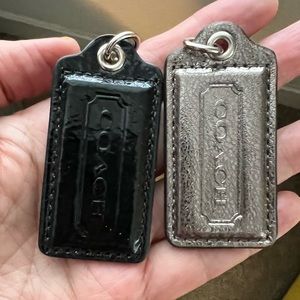 Two Coach leather silver metallic and black patent leather hang tags